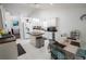 Bright kitchen featuring white cabinets, an island, and modern appliances at 2840 General Lee Way, Buford, GA 30519