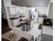 Well-lit kitchen with a center island and white appliances at 2840 General Lee Way, Buford, GA 30519