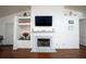 Living room featuring a marble fireplace and built-in shelving at 2840 General Lee Way, Buford, GA 30519