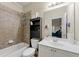 Bathroom with a tiled shower and tub combo, and single sink vanity with storage at 3642 Princeton Ave, Atlanta, GA 30337