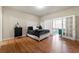 Sizable bedroom with hardwood floors, natural light, and french doors to an outdoor seating area at 3642 Princeton Ave, Atlanta, GA 30337