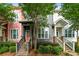Charming townhomes with stone accents, landscaped front yards, and inviting staircases leading to covered entryways at 3642 Princeton Ave, Atlanta, GA 30337