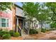 Street view of colorful townhomes showcasing well-maintained landscaping and inviting front entrances at 3642 Princeton Ave, Atlanta, GA 30337