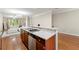 Kitchen with granite countertops, stainless steel dishwasher, and open view to the living area at 3642 Princeton Ave, Atlanta, GA 30337