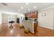 Open kitchen featuring stainless steel appliances and a breakfast bar, flowing into the dining area at 3642 Princeton Ave, Atlanta, GA 30337