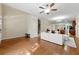 Bright living area featuring hardwood floors, a staircase, and open access to the kitchen at 3642 Princeton Ave, Atlanta, GA 30337