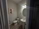Cozy half-bathroom with modern fixtures, a pedestal sink, and neutral decor providing a clean look at 7621 Gray Pointe Dr, Lithonia, GA 30058