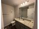 Well-lit bathroom featuring a granite countertop and a shower/tub combo at 7621 Gray Pointe Dr, Lithonia, GA 30058