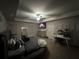 Cozy bedroom with ceiling fan, TV, walk-in closet, and carpeted floors at 7621 Gray Pointe Dr, Lithonia, GA 30058