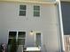The backyard of this home features a door, table and chair set, and neutral siding at 7621 Gray Pointe Dr, Lithonia, GA 30058