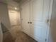 Hallway featuring closet and door leading to other rooms of the home at 7621 Gray Pointe Dr, Lithonia, GA 30058