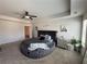 Spacious main bedroom with a round bed, ceiling fan, and modern decor at 7621 Gray Pointe Dr, Lithonia, GA 30058