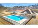 Community pool with a playground and tennis courts in the background at 7621 Gray Pointe Dr, Lithonia, GA 30058