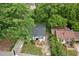 Overhead view of cozy home nestled among mature trees in a neighborhood setting at 1377 Pine Ave, Atlanta, GA 30344