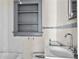 Bathroom features a sink, toilet and built in shelving at 1377 Pine Ave, Atlanta, GA 30344