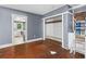 Bedroom featuring hardwood floors, a closet, and an open doorway at 1377 Pine Ave, Atlanta, GA 30344