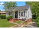 Charming home with white siding, gray shutters, and mature landscaping at 1377 Pine Ave, Atlanta, GA 30344