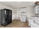 Kitchen featuring vintage appliances, neutral floors, and an adjacent open doorway at 1377 Pine Ave, Atlanta, GA 30344
