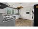 Kitchen featuring vintage appliances, open cabinetry, and natural light at 1377 Pine Ave, Atlanta, GA 30344
