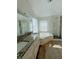 A full bathroom is upgraded with a granite countertop and an oversized tub with shower at 479 Rising Sun Path, Lawrenceville, GA 30043