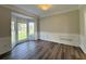 A naturally lit dining room showcases beautiful wood trim and wainscoting at 479 Rising Sun Path, Lawrenceville, GA 30043