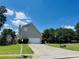 View of driveway leading to home with basketball hoop on a sunny day at 479 Rising Sun Path, Lawrenceville, GA 30043