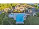 Aerial view of the community clubhouse and pool with play area, chairs and umbrellas for residents at 6150 Bridge Fair Rd, Cumming, GA 30028