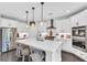 Beautiful kitchen with a large island, stainless steel appliances, and white cabinetry at 6150 Bridge Fair Rd, Cumming, GA 30028