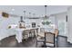 Modern kitchen with white cabinets, stainless steel appliances, and a center island with seating at 6150 Bridge Fair Rd, Cumming, GA 30028