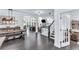 Open-concept living space with hardwood floors, staircase, and natural light at 6150 Bridge Fair Rd, Cumming, GA 30028