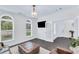 Inviting living area with plush seating, modern lighting, and views of the outdoors at 6150 Bridge Fair Rd, Cumming, GA 30028