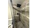 Bathroom featuring a glass enclosed shower with gray tile surround and rainfall shower head at 123 Rue Fontaine, Lithonia, GA 30038