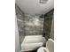 Bathroom featuring a shower with a gray tile surround and rainfall shower head at 123 Rue Fontaine, Lithonia, GA 30038