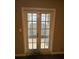 French doors leading to a bright room with natural light and a gray color scheme at 123 Rue Fontaine, Lithonia, GA 30038
