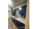 Modern kitchen with granite countertops, stainless steel appliances, and blue tile backsplash at 123 Rue Fontaine, Lithonia, GA 30038