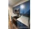 The kitchen features granite countertops, stainless appliances, and a tiled backsplash at 123 Rue Fontaine, Lithonia, GA 30038