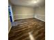 Inviting living room with new floors and neutral paint, perfect for relaxation at 123 Rue Fontaine, Lithonia, GA 30038