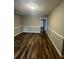 Inviting living room showcasing modern flooring, trim and an updated ceiling light at 123 Rue Fontaine, Lithonia, GA 30038