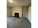 Neutral living room featuring a fireplace and plush gray carpeting at 123 Rue Fontaine, Lithonia, GA 30038