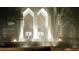 An eye-catching building entrance is illuminated and features a beautiful water feature in the foreground at 2870 Pharr Court South Nw # 901, Atlanta, GA 30305