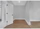 Bright bedroom with wood-look floors, modern trim, and neutral paint at 3312 Mill Forest Dr, Conyers, GA 30094