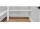 Spacious closet with white shelves and light wood floor at 3312 Mill Forest Dr, Conyers, GA 30094