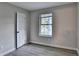 Cozy bedroom featuring hardwood floors, a window, and fresh neutral paint at 4384 Raven Valley Ct, Decatur, GA 30035