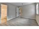 Bedroom with an en-suite bathroom, open doorway, and vinyl flooring at 4384 Raven Valley Ct, Decatur, GA 30035