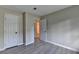 Bedroom featuring luxury vinyl plank flooring and two doors at 4384 Raven Valley Ct, Decatur, GA 30035