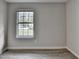 Neutral bedroom with a window at 4384 Raven Valley Ct, Decatur, GA 30035