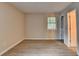 Bedroom featuring vinyl flooring and view of the open doorway at 4384 Raven Valley Ct, Decatur, GA 30035