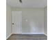 Bedroom with hardwood floors, a modern door, and fresh neutral paint at 4384 Raven Valley Ct, Decatur, GA 30035