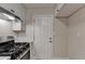 Kitchen with stainless steel appliances, a gas range, and access to an exterior door at 4384 Raven Valley Ct, Decatur, GA 30035