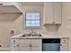 Bright kitchen featuring white cabinets, marble countertops, and a stainless steel faucet at 4384 Raven Valley Ct, Decatur, GA 30035